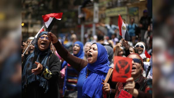 Egypt's military takes over state TV as Mursi refuses to step down