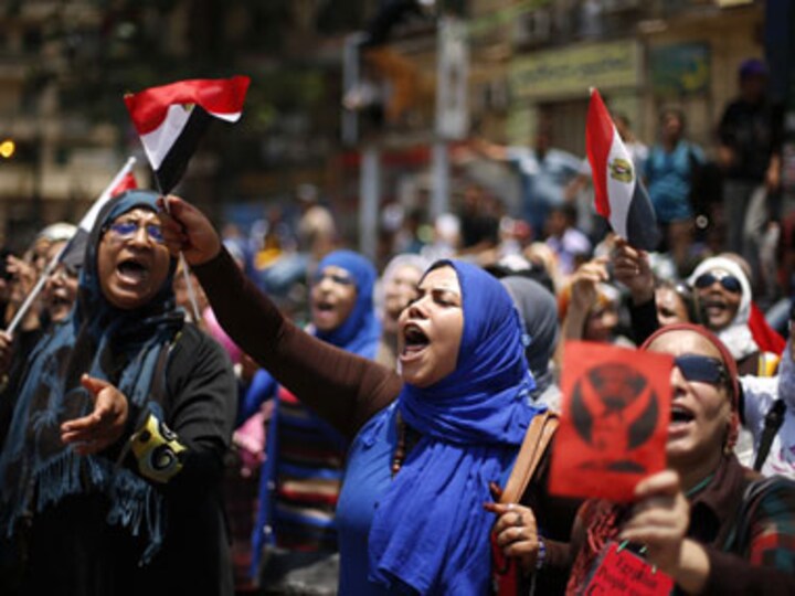 Egypt's military takes over state TV as Mursi refuses to step down