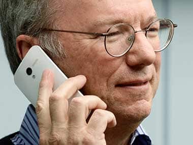 Eric Schmidt with Moto X smartphone. AFP 