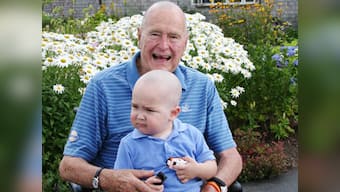 George HW Bush shaves head in support of boy with leukemia