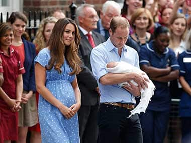 Kate Middleton, Prince William with their son George. AP
