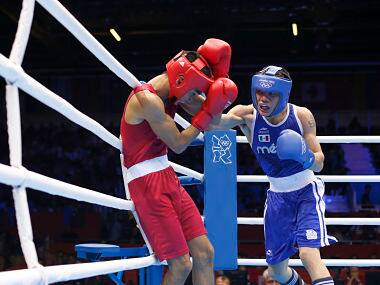 India's Shiva Thapa (L) connects with a right hand against Mexico's Oscar Valdez Fierro in their Men's Bantam (56kg) round of 32 bout. Reuters