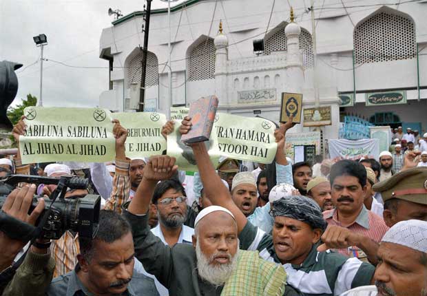 Darsgah Jihad-o-Shahadat activists  holding placards and Holy Quran during a protest in Hyderabad on Friday against the alleged desecration of the Holy Quran by BSF personnel at Ramban in Jammu and Kashmir. PTI 