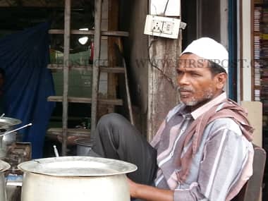 Mohd. Samir, owner Subhanallah Hotel near Jama Masjid in New Delhi says here's what one gets in his hotel -- for Rs. 1, Rs. 5: nothing and for Rs. 12: Three plain chapattis. Arlene Chang/Firstpost.