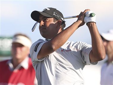 Shiv Kapur of India plays a shot off the 13th tee during the first round of the British Open Golf Championship. AP