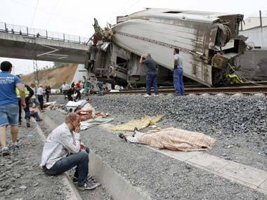 Wounded people and dead bodies are seen at the site of the train accident in Santiago de Compostela in Spain. AP