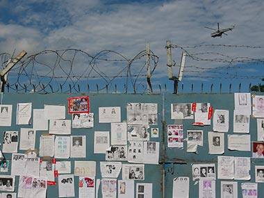 Photos of missing people outside the Dehradun airport. Reuters 