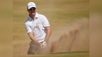 The Open Championship: Johnson leads while Woods lurks three shots back