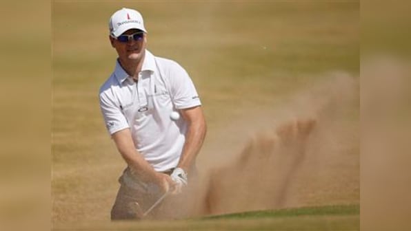 The Open Championship: Johnson leads while Woods lurks three shots back