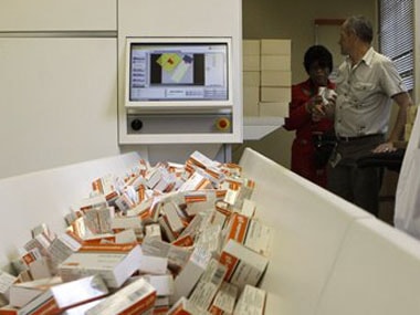 A file photo of a newly mechanized pharmaceutical machine that helps pharmacists dispense medicine is loaded with ARV medication. AP