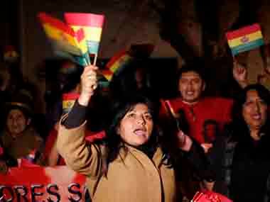 Supporters of Bolivia's President Evo Morales shout and wave Bolivian flags outside France's embassy as they protest in La Paz. AP