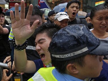 Protesters scuffle with police officers during an annual pro-democracy protest in Hong Kong. AP image
