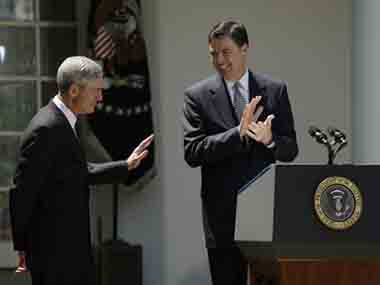 FBI Director Robert Mueller, left, acknowledges the applause the president’s nominee to replace Mueller , James Comey, center. AP