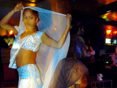 Performers at a dance bar. AFP.