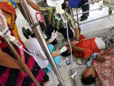 Dengue patients lie on floors due to lack of space at a hospital in a New Delhi. PTI
