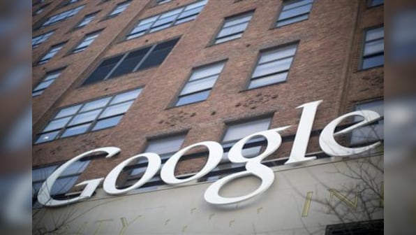 Falling ad rates, Motorola losses dent Google's Q2 results
