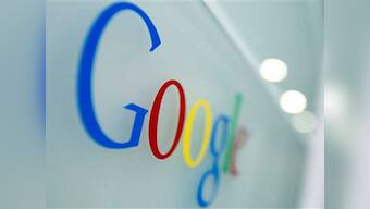 Falling ad rates, Motorola losses dent Google's Q2 results