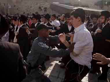 Representative image of an ultra-orthodox Jewish men scuffling with Israeli security forcers. AP