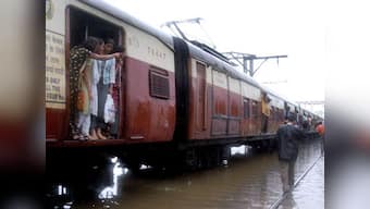 Rains lash Mumbai causing traffic jams, disrupting suburban railways