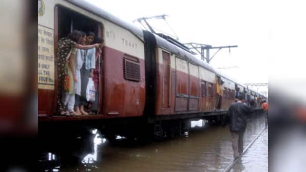 Rains lash Mumbai causing traffic jams, disrupting suburban railways
