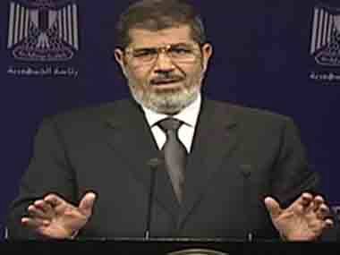 An image made from video broadcast showing Mohammed Morsi addressing the nation. AP