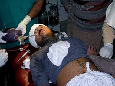 An injured polio aid worker in Pakistan. Agencies.