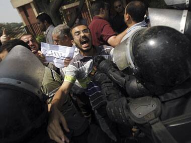 Members of the Muslim Brotherhood and supporters of ousted Egyptian President Mohamed Morsi shout slogans and clash with riot police. Reuters