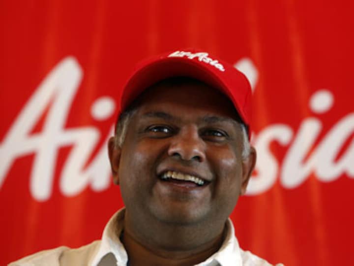 AirAsia CEO Tony Fernandes and chairman step aside as Airbus bribery allegations probed; airline shares drop