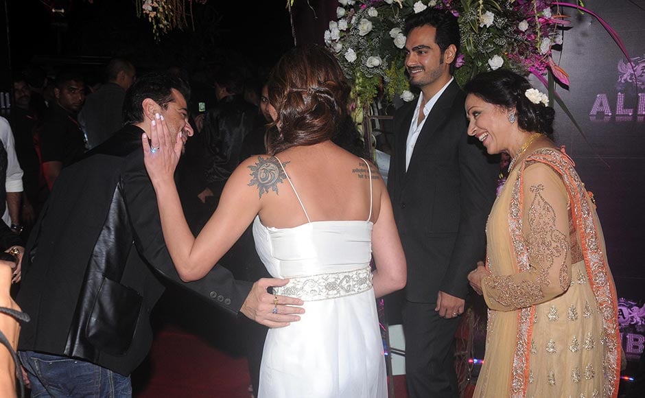 Sanjay Kapoor, Esha Deol (in white) Hema Malini and Esha's husband Bharat Tatkhtani at the party. Sachin Gokhale/Firstpost Sanjay Kapoor, Esha Deol (in white) Hema Malini and Esha's husband Bharat Tatkhtani at the party. Sachin Gokhale/Firstpost
