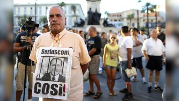 Berlusconi's conviction leaves Italian coalition govt hanging