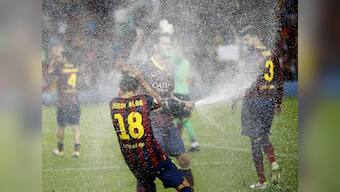 Barcelona survive Atletico scare to win Super Cup on away goals