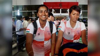 Gold-medal winning archery team come home to drab welcome