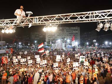Supporters of deposed Egyptian President Mohamed Mursi shout slogans during a protest at the Rabaa al-Adawiya square where they are camping in Cairo. Reuters