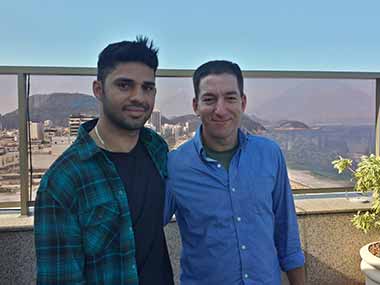 In this undated photo released by Janine Gibson of The Guardian, Guardian journalist Glenn Greenwald, right, and his partner David Miranda are seen together. Associated Press