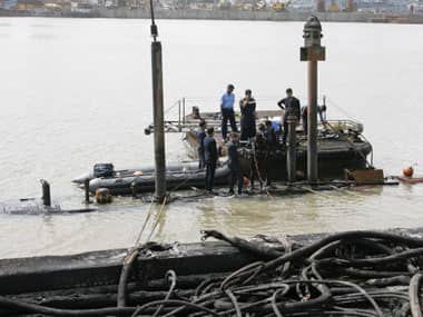 Navy personnel at the site of the incident. AFP