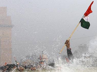n this photograph taken on December 23, 2012, demonstrators are hit by water cannon during a protest, in front of the India Gate monument in New Delhi. AFP 