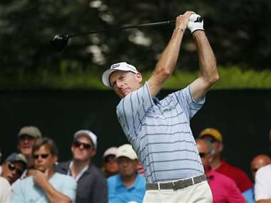 Jim Furyk follows through on his tee shot on 8 during the first round of the PGA Championship golf tournament at Oak Hill. AP