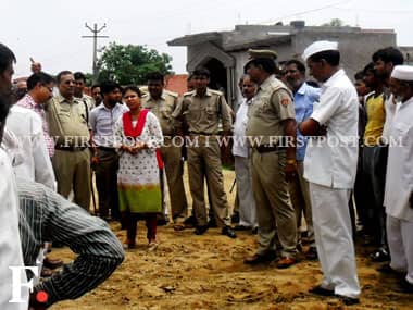 A photo by one of the residents shows Nagpal at the site of the demolition: Firstpost