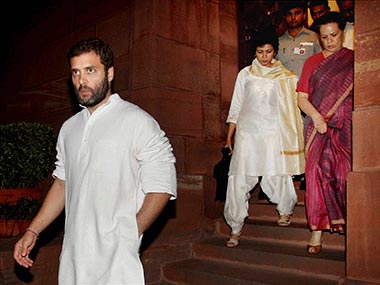 Congress President Sonia Gandhi and Rahul Gandhi leave Parliament House during the discussion on National Food Security Bill 2013 in the Lok Sabha in New Delhi. PTI