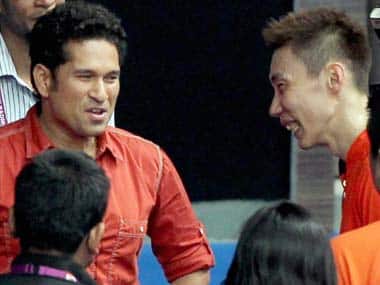 Sachin Tendulkar and Lee Chong Wei share a laugh at the IBL match in Mumbai. PTI