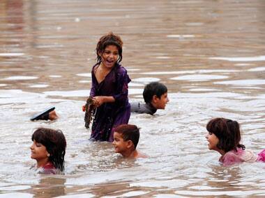 Children play in flood water in Pakistan. Representative image. AFP.