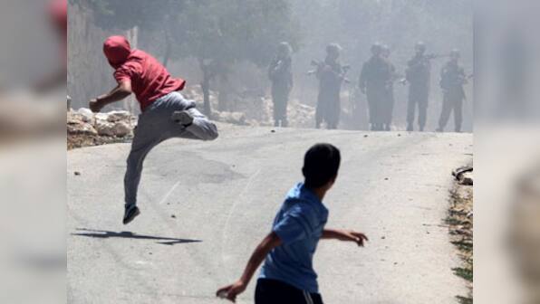 One Palestinian dead, another shot as tensions high in West Bank