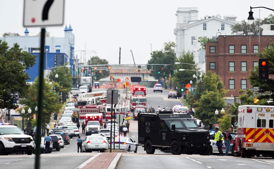 Police block off the M Street, SE, as they respond to a shooting at the Washington Navy Yard in Washington, September 16, 2013. The U.S. Navy said several people were injured and there were possible fatalities in the shooting at the Navy Yard in Washington D.C. on Monday. The Navy did not immediately provide additional details but a Washington police spokesman said earlier that five people had been shot, including a District of Columbia police officer and one other law enforcement officer. REUTERS/Joshua Roberts 