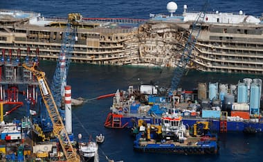 Photos: Capsized cruiseliner Costa Concordia pulled upright