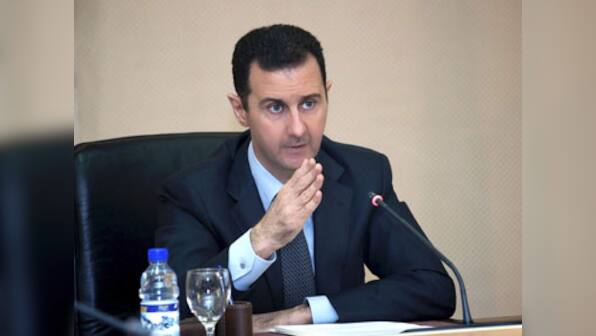 Assad says the US will 'pay the price' for a strike on Syria