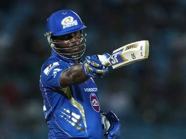 Dwayne Smith points to the dugout in celebration after reaching his half-century. BCCI