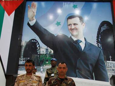 UN observers leave the governorate of Hama building after meeting Syrian officials during the United Nations observers' visit to Hama. Reuters