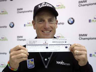 Jim Furyk shows off his scorecard after shooting 59 in the second round of the BMW Championship. AP
