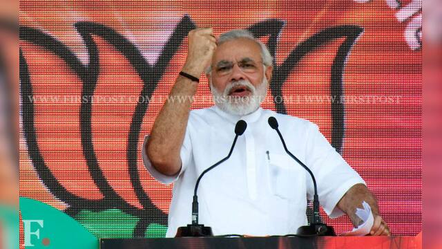 Photos: Narendra Modi woos audience at BJP Delhi rally – Firstpost
