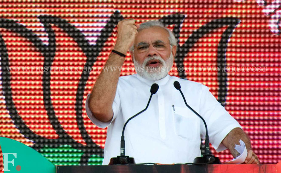 Photos: Narendra Modi woos audience at BJP Delhi rally – Firstpost